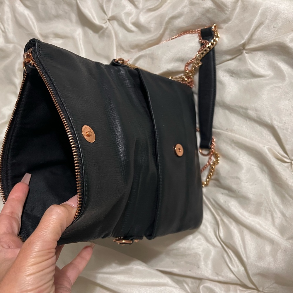 Two gold strap bag.